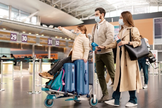 Family wearing face masks at airport