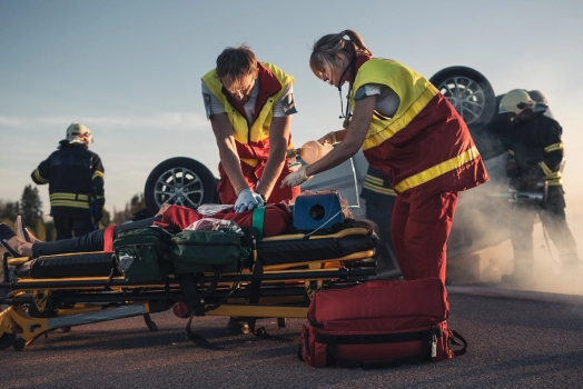 Paramedics Saving Life of a Victim who is Lying on Stretchers