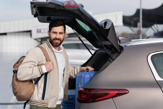 man holding baggage