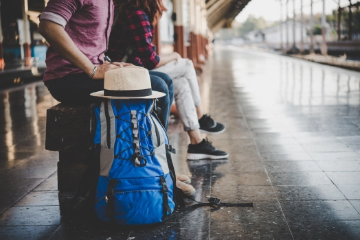 Passengers waiting in platform with their luggage