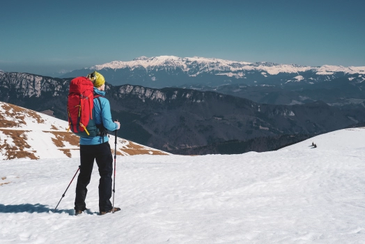 Hiker standing together on snow covered mountain